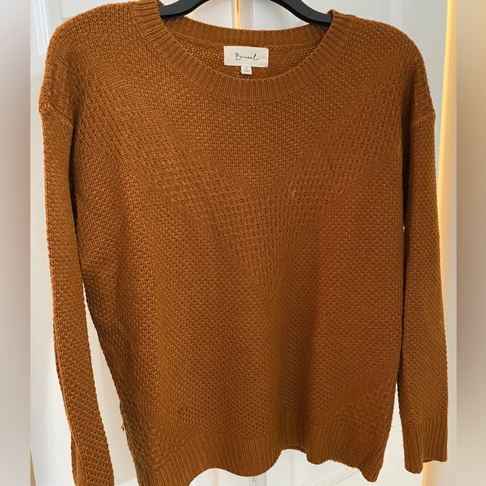 Knit sweater by Becaal. Medium weight, long sleeve. Rust color. Size small.
